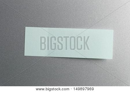 Blue of Note paper placed on refrigerator backgroundDesign ideas can be Entered your Message into the space as needed.