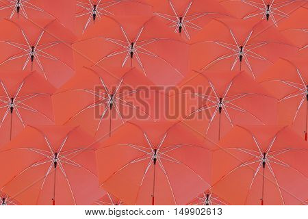 Many red umbrella concatenation to abstract background.