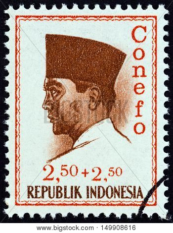 INDONESIA - CIRCA 1965: A stamp printed in Indonesia shows president Sukarno commemorating the 1965 Conference of New Emerging Forces, Djakarta Conefo, circa 1965.