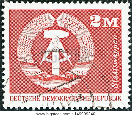 GERMAN DEMOCRATIC REPUBLIC - CIRCA 1973: A stamp printed in Germany shows Coat of Arms, circa 1973.