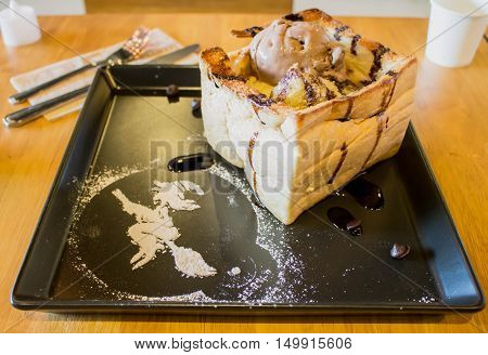 toasted bread with chocolate ice cream with a icing witch decoratehalloween