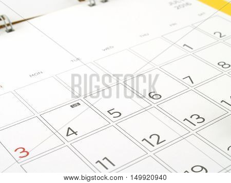 desk calendar with days and dates in July 2016, acronym letters US in the fourth of July, the symbol of American Independence Day