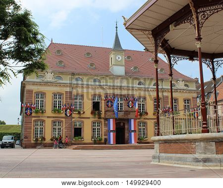 BELFORT, FRANCE, JULY 27 2016: The Town Hall and Place de Armes in Belfort in the Franche-Comte area of France. Belfort is a large town and popular tourist destination.