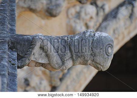 Lisbon, Portugal - October 21, 2014. Gargoyle representing a grasshopper at the upper balustrade of Mosteiro dos Jeronimos in Lisbon.