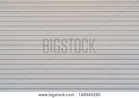 Background of gray steel fence without paint