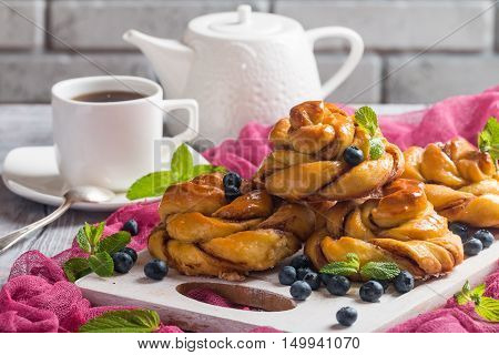 Homemade pumpkin cinnamon yeasted buns, fall baking concept