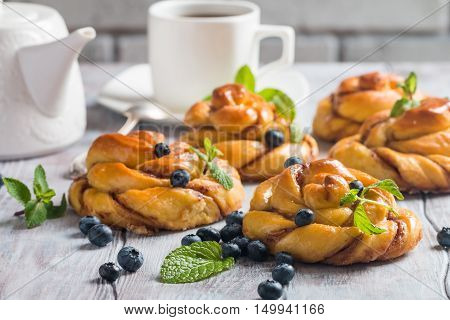 Homemade pumpkin cinnamon yeasted buns, fall baking concept