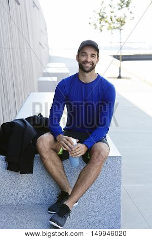 Portrait of smiling man in shorts and blue top