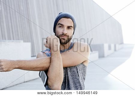 Cool Fitness fellow warming up before exercise
