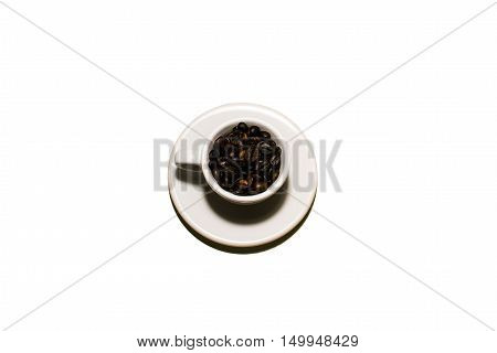 A coffee cup full of beans in a white background