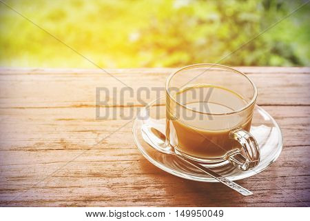 In the morning black coffee on the wooden floor.