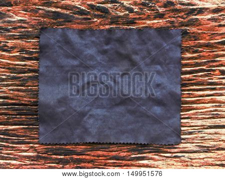 Black fabric on old wood for idea.