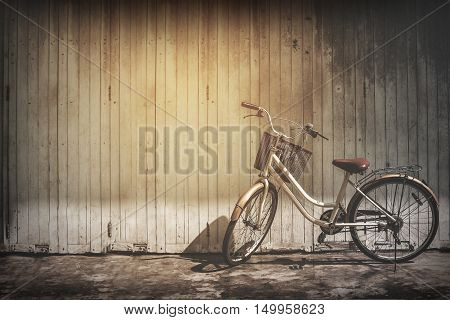 vintage bicycle on vintage wooden house wall