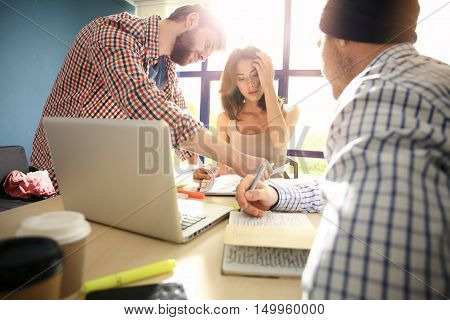Coworkers Work Process Modern Office Loft.Young Professionals Making Great Decision New Creative Idea.Business Team Working Startup. Happy web designers brainstorming about new sartup