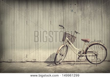 vintage bicycle on vintage wooden house wall