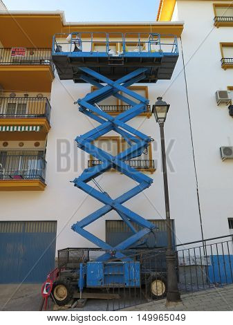 Mobile Elevating Working Platform outside apartment block