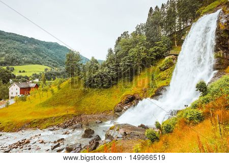 Waterfall Steindalsfossen, south Norway Summer rain weather