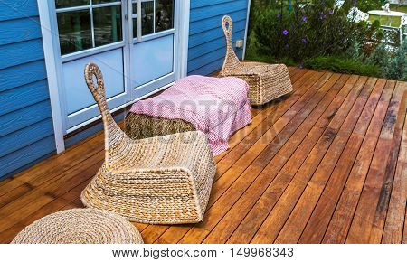 Sofas made from plants to weave placed on the terrace.