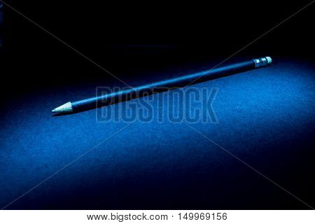 Lightpainting of a black pencil with black background