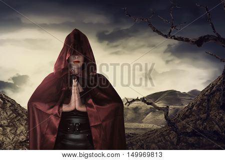 Beautiful Asian Witch Woman With Red Cloak Praying
