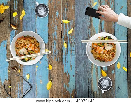 Bad manner of using smartphone while eating with other people.