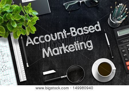 Account-Based Marketing Handwritten on Black Chalkboard. Top View of Black Office Desk with a Lot of Business and Office Supplies on It. 3d Rendering. Toned Image.