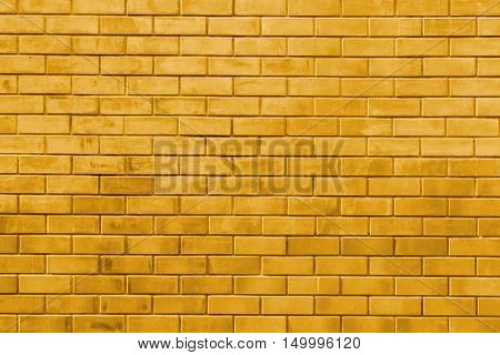 Yellow gold brick wall abstract texture background