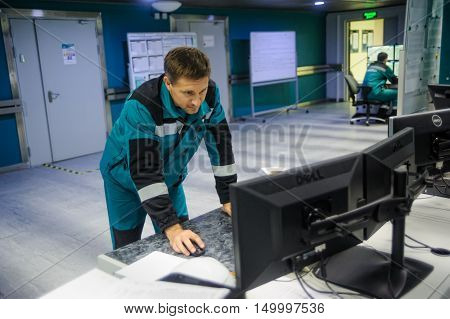 Tobolsk, Russia - July 15. 2016: Sibur company. Central control panel of Tobolsk Polymer plant. The engineering personnel watch in monitors work of the equipment
