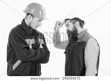 Builder, Architect, Engineer With Serious Face. Conflict At Site Concept. Men In Hard Hats, Uniform,