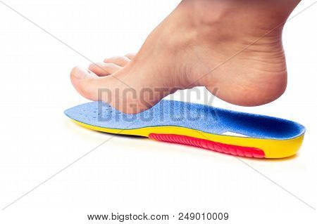 Orthopedic Insole And Female Leg Above It