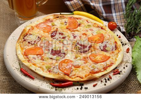 Pizza With Tomato, Cheese, Smoked Sausage, Boiled Sausage, Pepper Spices On A Wooden Tray Close-up