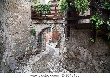 Picturesque old street in the town of Malcesine, Italy