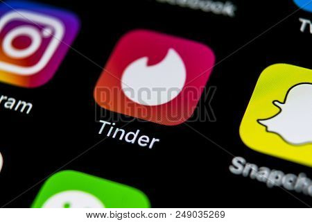 Sankt-petersburg, Russia, July 11, 2018: Tinder Application Icon On Apple Iphone X Screen Close-up. 