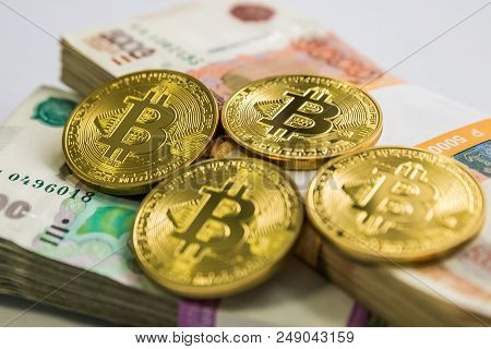Bitcoin Gold And The Russian Ruble. Bitcoin Coin On The Background Of Russian Rubles