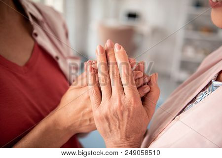 Devoted Daughter. Devoted Daughter Feeling Appreciation And True Devotion While Coming To Her Mother