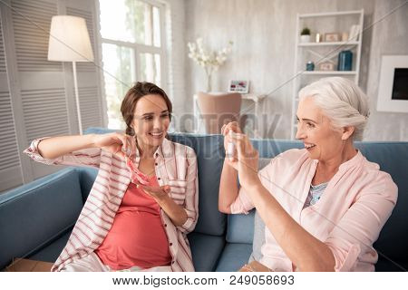 Expecting Daughter. Smiling Caring Aged Mother Feeling Unforgettable While Making Photo Of Expecting