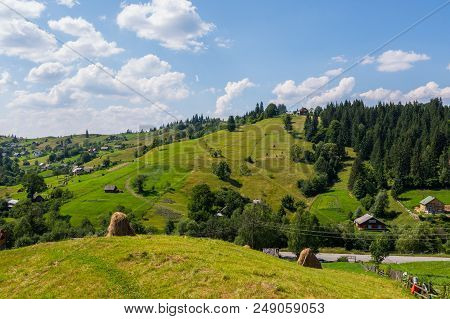 Carpathian Village In The Valleys With Rarely Poured Down Modest Houses