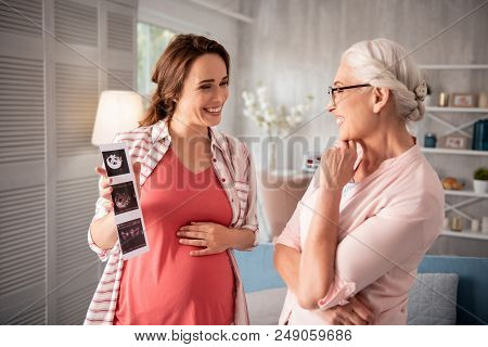 Sharing Happiness. Beaming Expecting Woman Feeling Extremely Excited While Coming For Sharing Happin