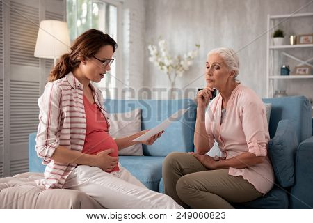 Private Consultation. Dark-haired Expecting Woman Coming For Private Consultation To Professional Th