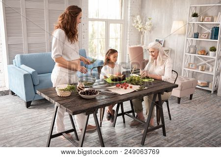 Cooking Together. Happy Friendly Family Cooking Healthy Nourishing Dinner Together In The Kitchen