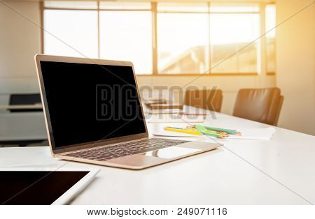 Laptop On The Table In The Meeting Room. Fintech And Technology