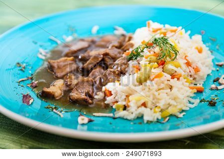Vietnamese style caramel pork with rice and vegetable
