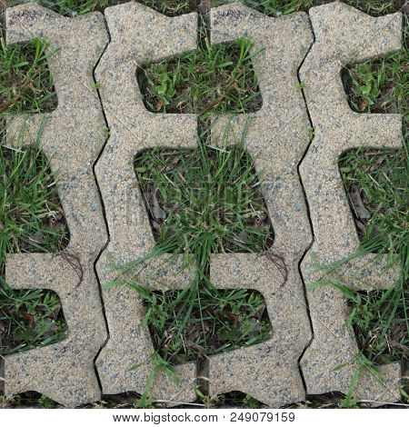 Seamles Pattern Of Concrete Road Tile On The Green Grass Path