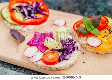 Open Sandwiches Of Rice Cakes With Cream Cheese , Vegetables, Healthy Breakfast