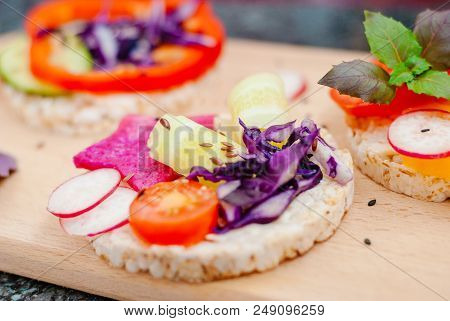 Open Sandwiches Of Rice Cakes With Cream Cheese , Vegetables, Healthy Breakfast