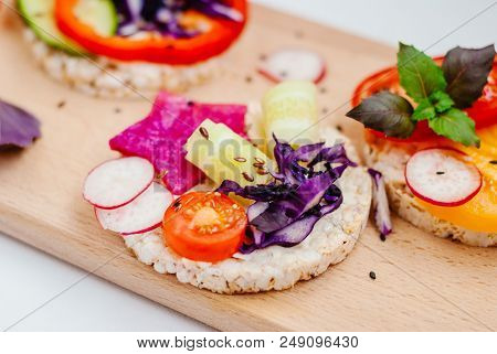 Open Sandwiches Of Rice Cakes With Cream Cheese , Vegetables, Healthy Breakfast