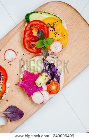 Open Sandwiches Of Rice Cakes With Cream Cheese , Vegetables, Healthy Breakfast