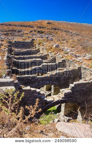 Ancient Ruins In The Island Of Delos In Cyclades, One Of The Most Important Mythological, Historical