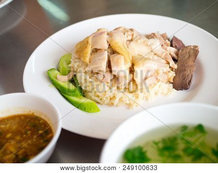 Hainanese Chicken Rice On A Plate With Soup