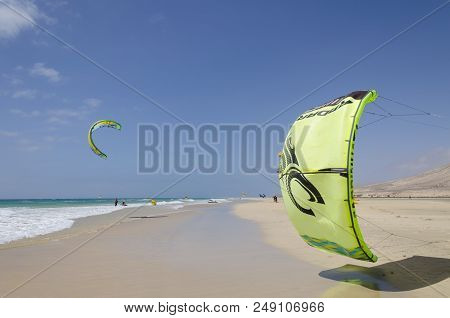 Sotavento Beach, Fuerteventura, Canary Islands, Spain; May 28, 2018: Kites In The Blue Sky Over Sota